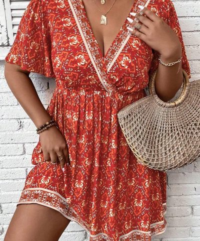 Orange Plus Size Printed Surplice Neck Empire Waist Flowy Mini Dress
